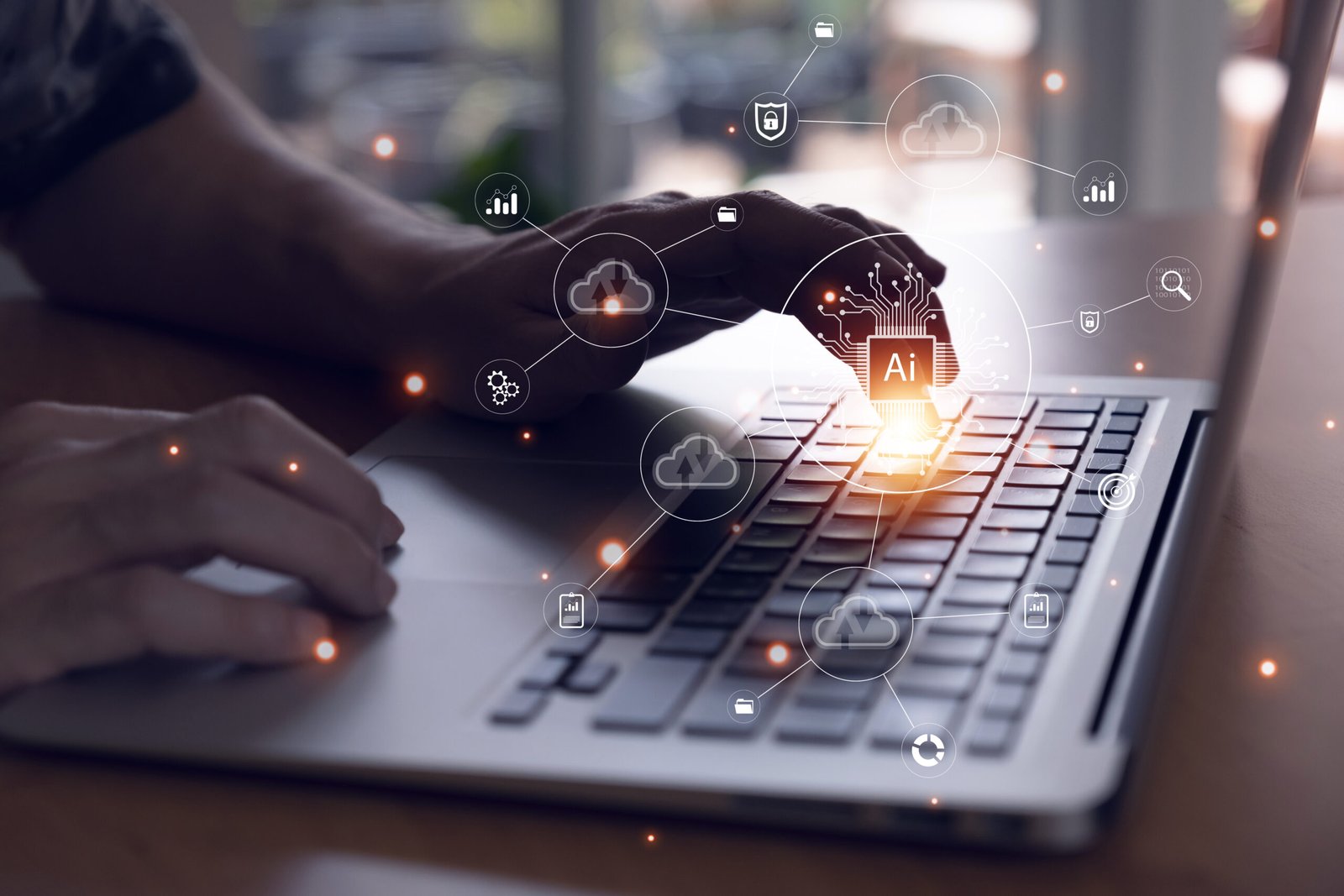 Close-up of a person typing on a laptop with AI technology icons overlayed, representing cloud computing, automation, and data.